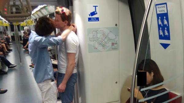 men_kissing_gay_mrt_homophobia_1