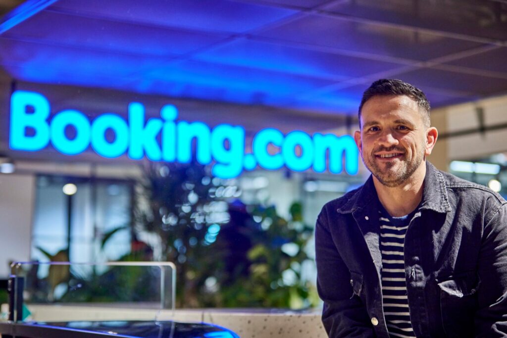 Booking.com's Lewis Bell speaks to mygwork about travelling and how that helped inform his identity