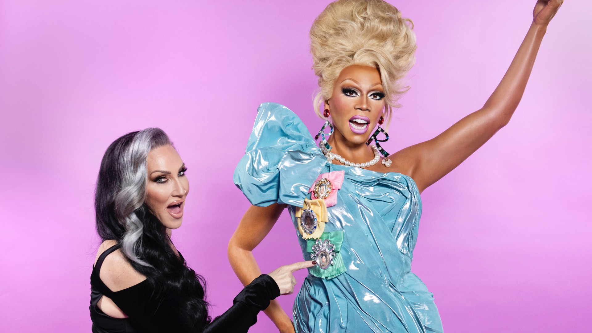 Michelle Visage poses alongside RuPaul's waxwork