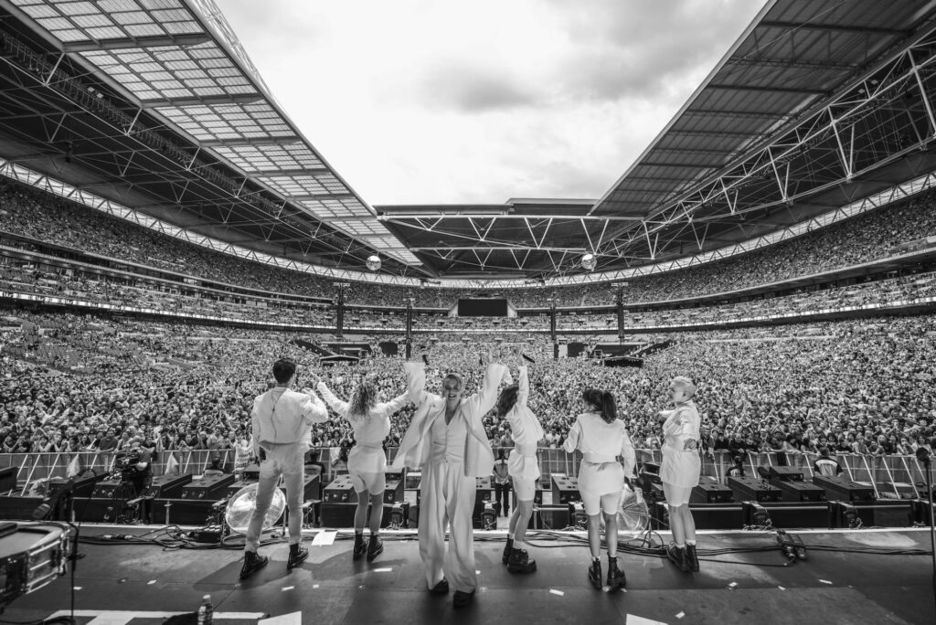 Black and white image of Self Esteem performing at Wembley
