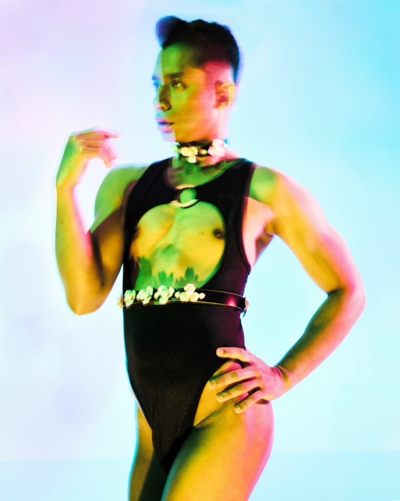 Stylised image of a drag artist against a gradient backdrop