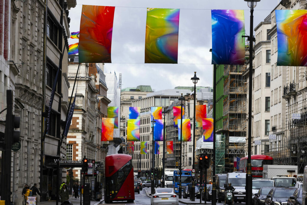 Artist and RA alumni Adham Faramawy's collection of new flags titled ‘Rainbow Flags’ at Piccadilly in London 