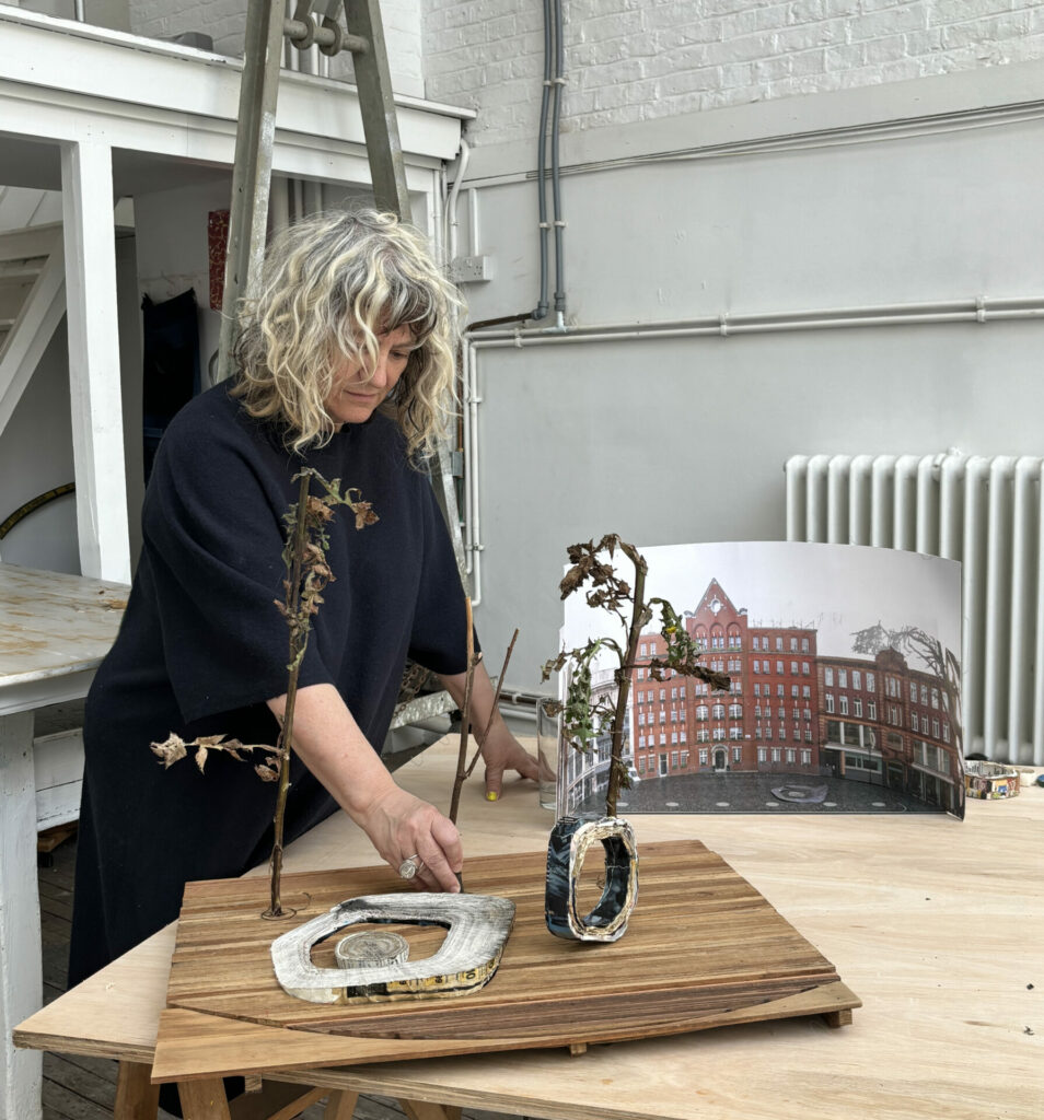 Anya Gallaccio in her studio with a maquette of her winning proposal