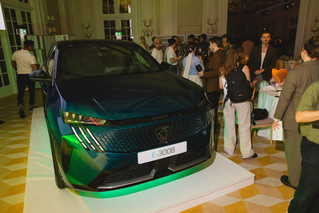 A PEUGEOT E-3008 parked in the Raffles ballroom 