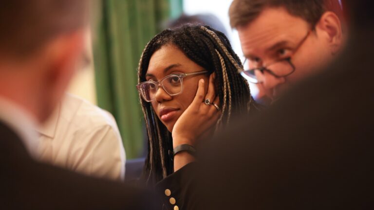 A close-up of Kemi Badeboch's face as she attended a meeting in Parliament