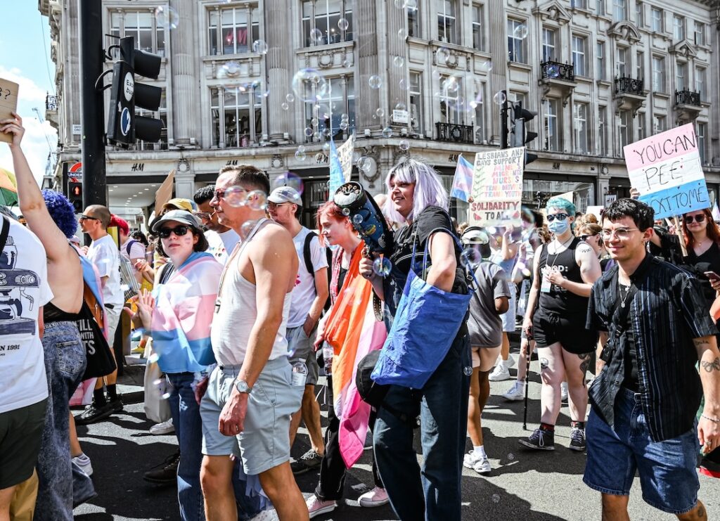 A crowd shot, including someone holding a bubble gun