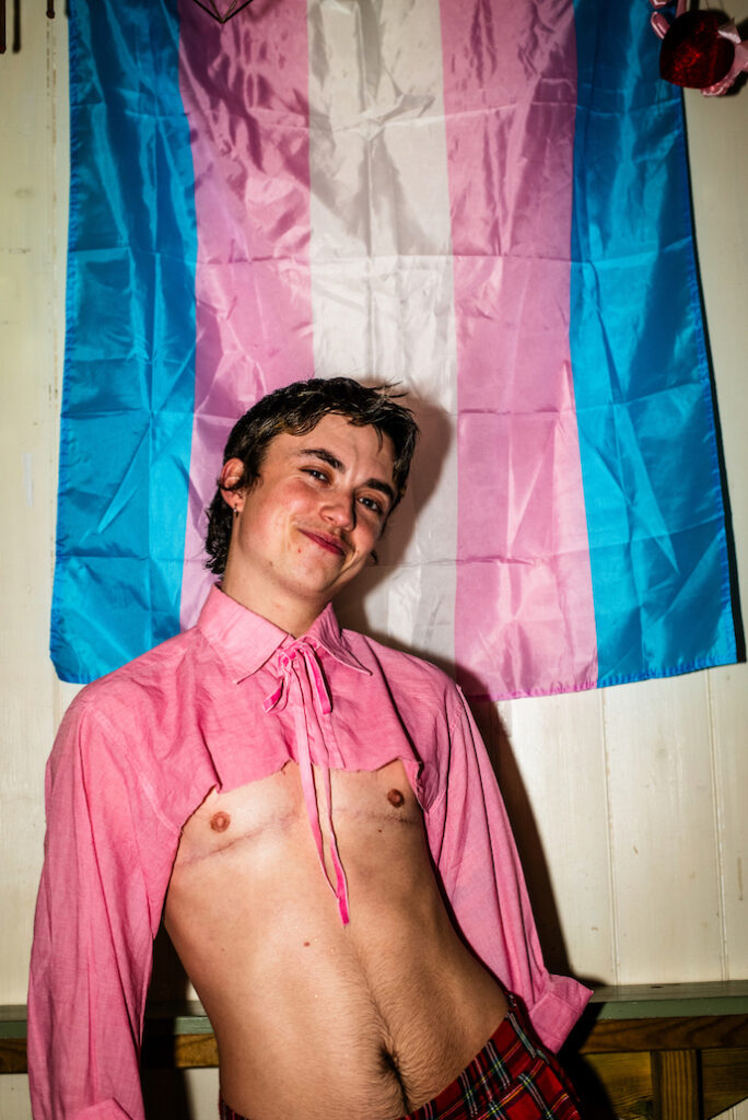 An attendee in a pink cut off shirt