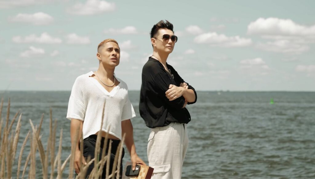 Manila Luzon and her husband Michael standing on a beach