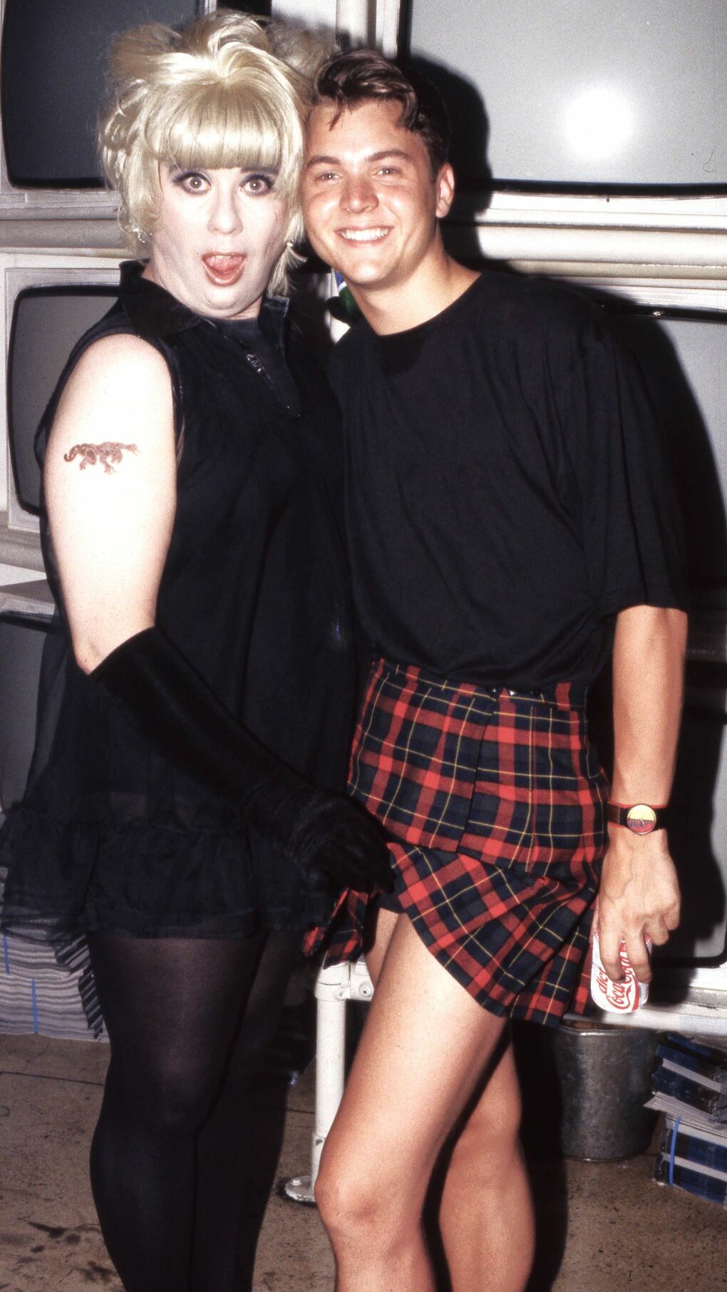 A drag queen and man wearing a kilt