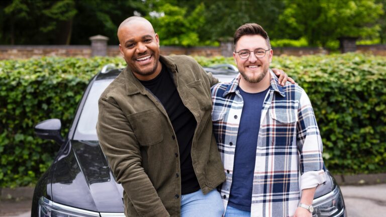 The Traitors star Miles and his partner standing by a car