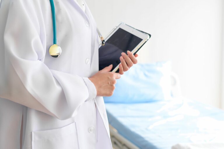 Stock image of a doctor holding an iPad