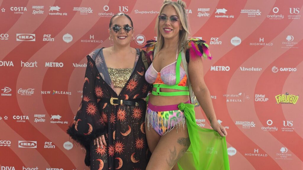 Two women wearing colourful outfits