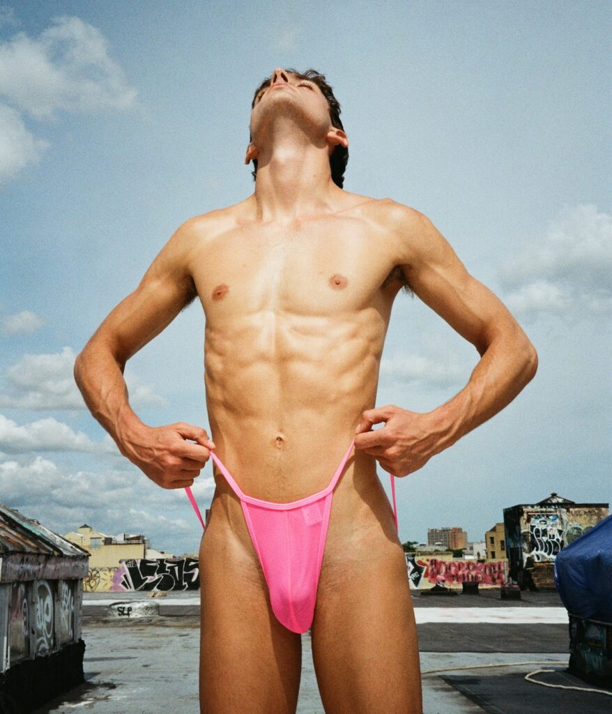 A man in pink swimwear