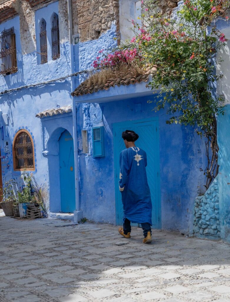 A man walking the streets of Chefchaouen