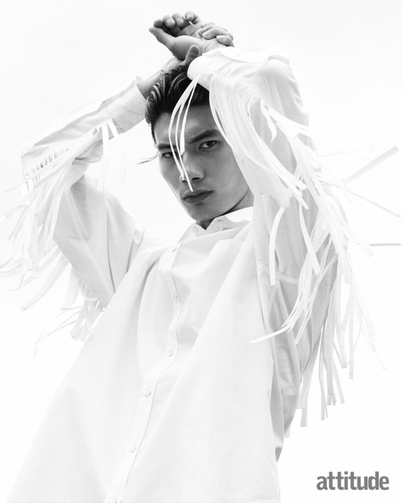 Model wears white shirt with fringe sleeves by Moschino