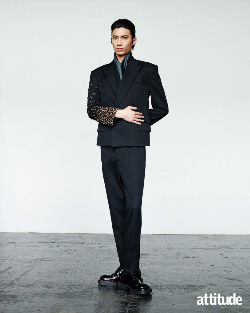 Model wearing Armani suit, with sequin embroidery on sleeve