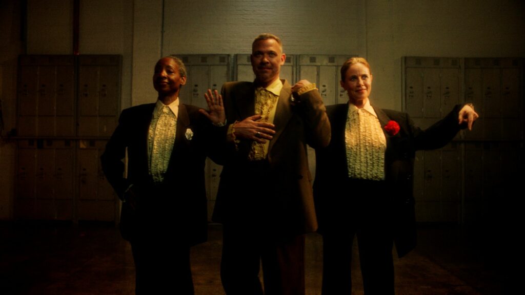 Will Young stands between two female dancers