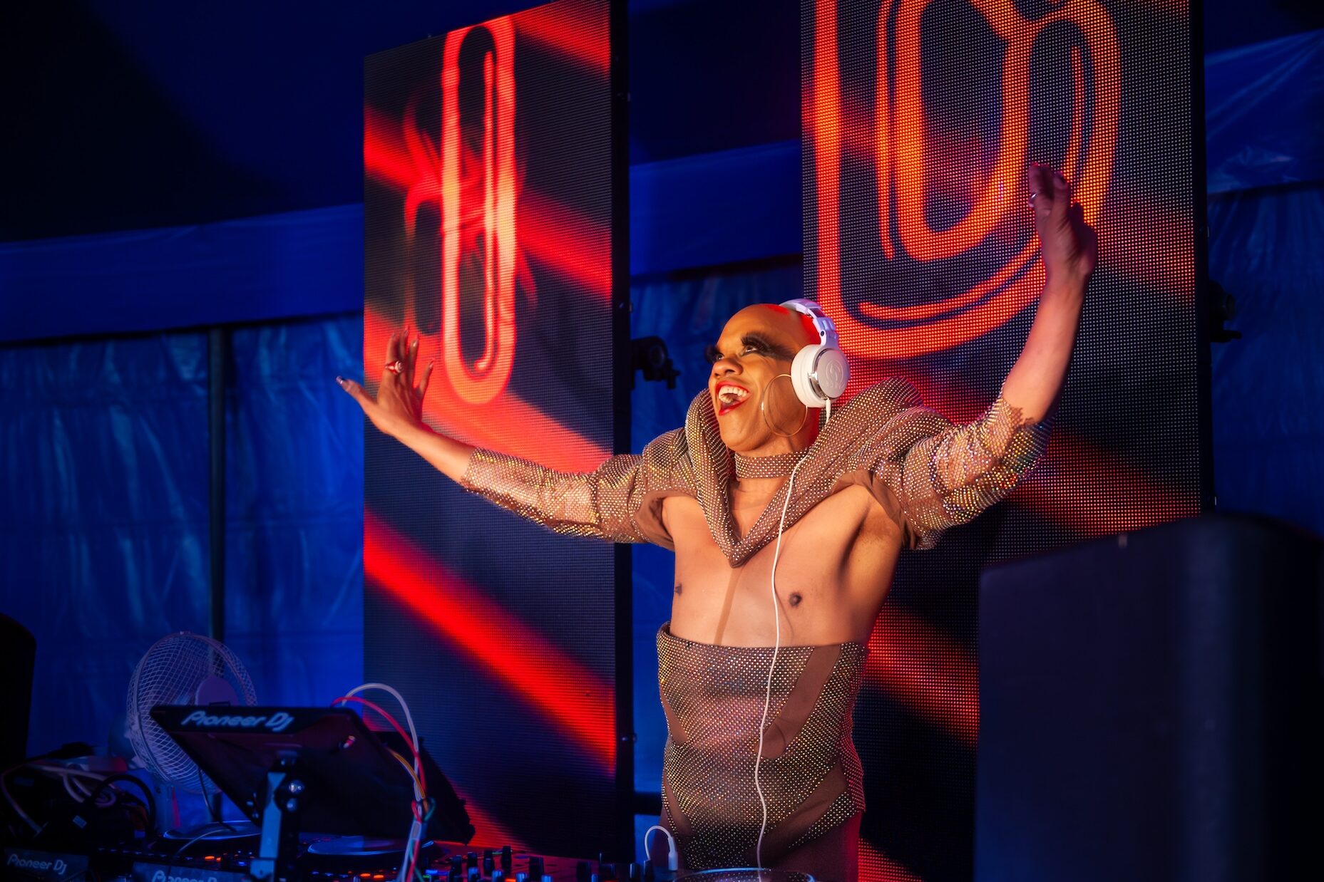 A DJ performing in one of the dance tents