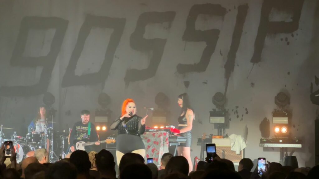 Gossip standing on stage