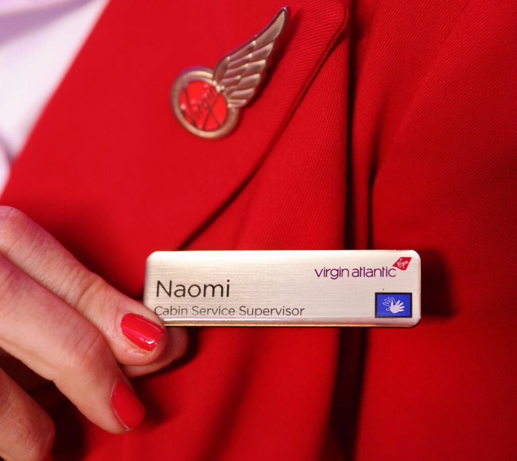 A Virgin Atlantic cabin crew badge showing they have BSL training