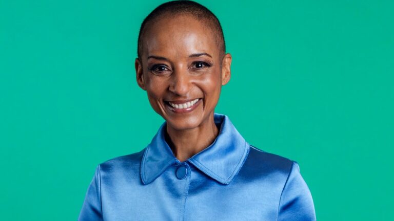 Adele Roberts smiling against a green backdrop