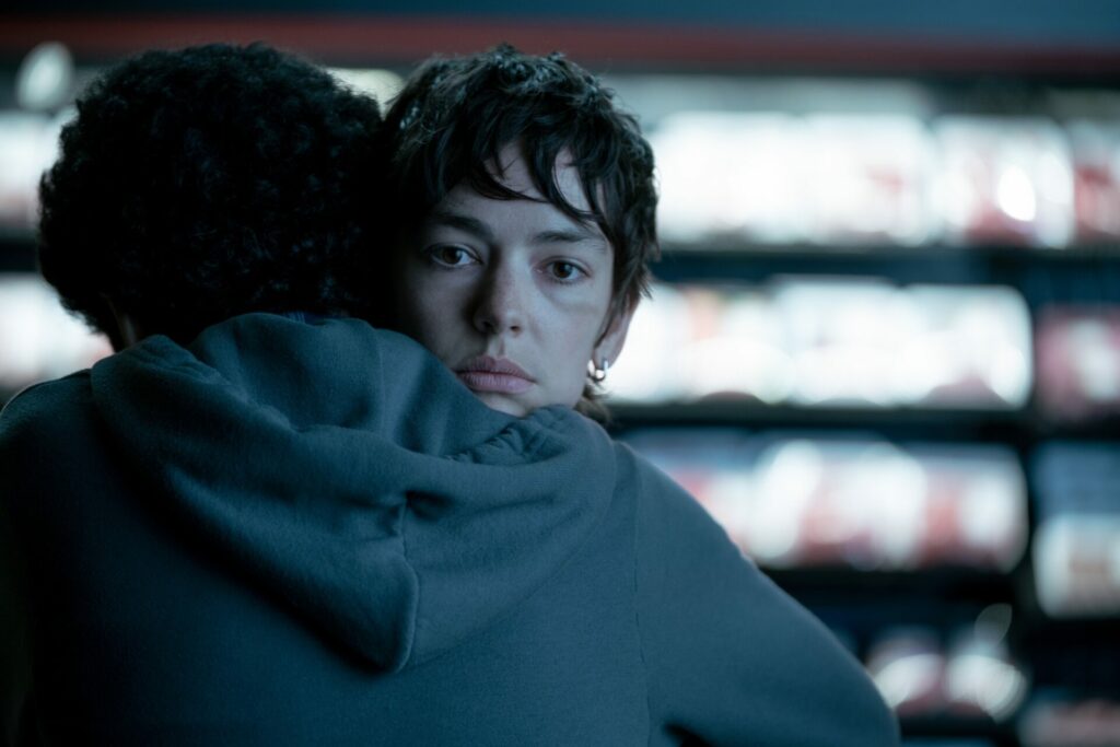 Brigette and Justice embrace in a still from the film I Saw the TV Glow