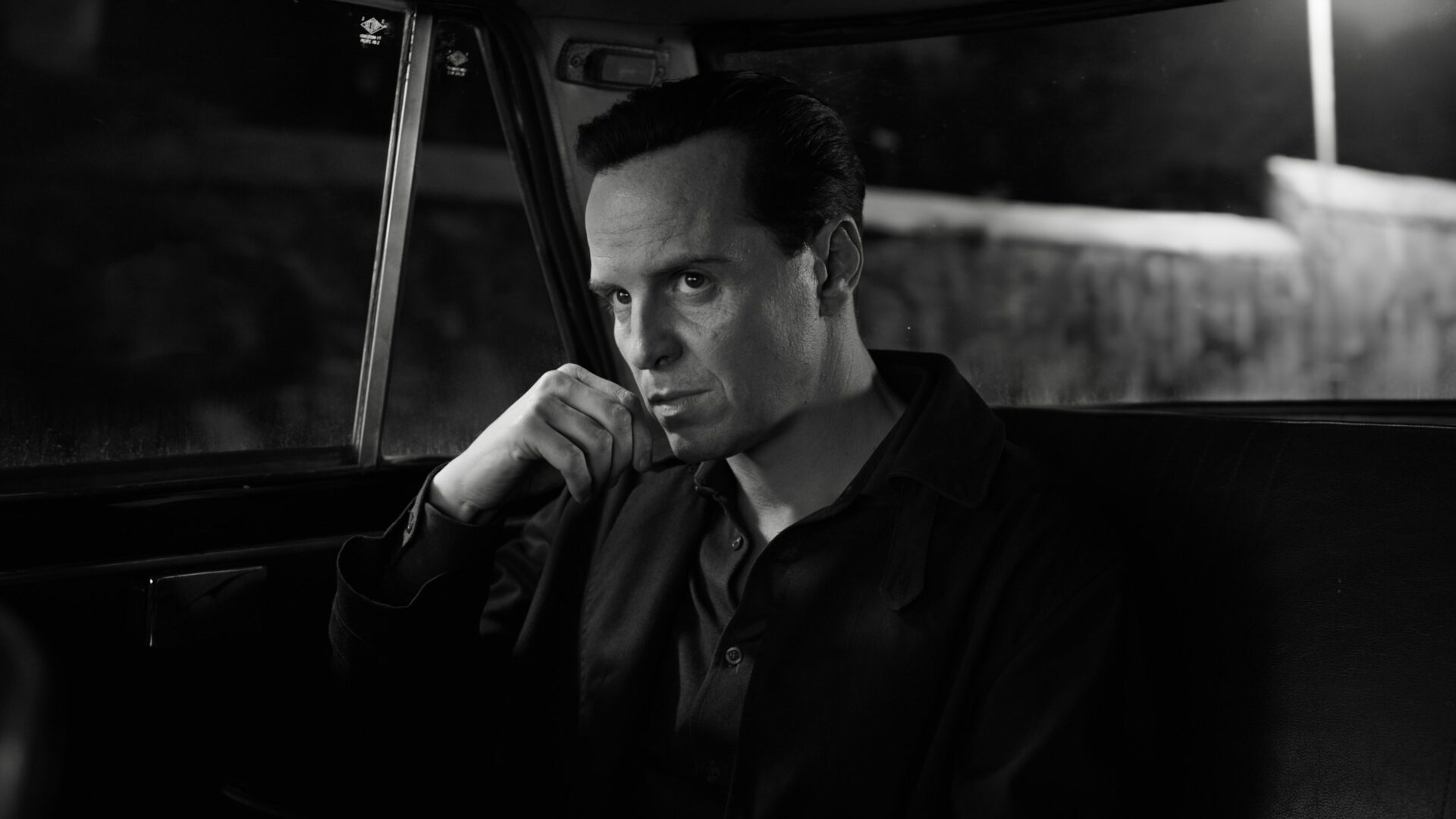 A black and white still of Andrew Scott in Ripley