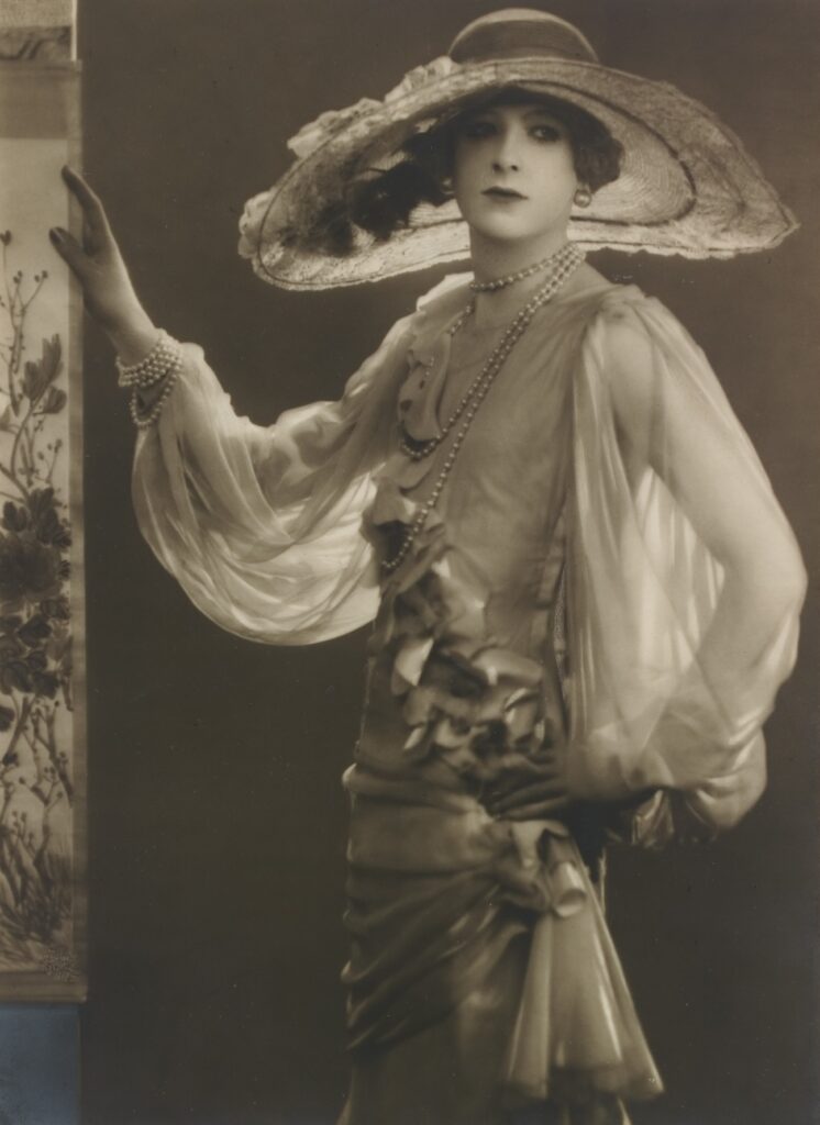 Dorothy Wilding (1893–1976) in a white dress and hat