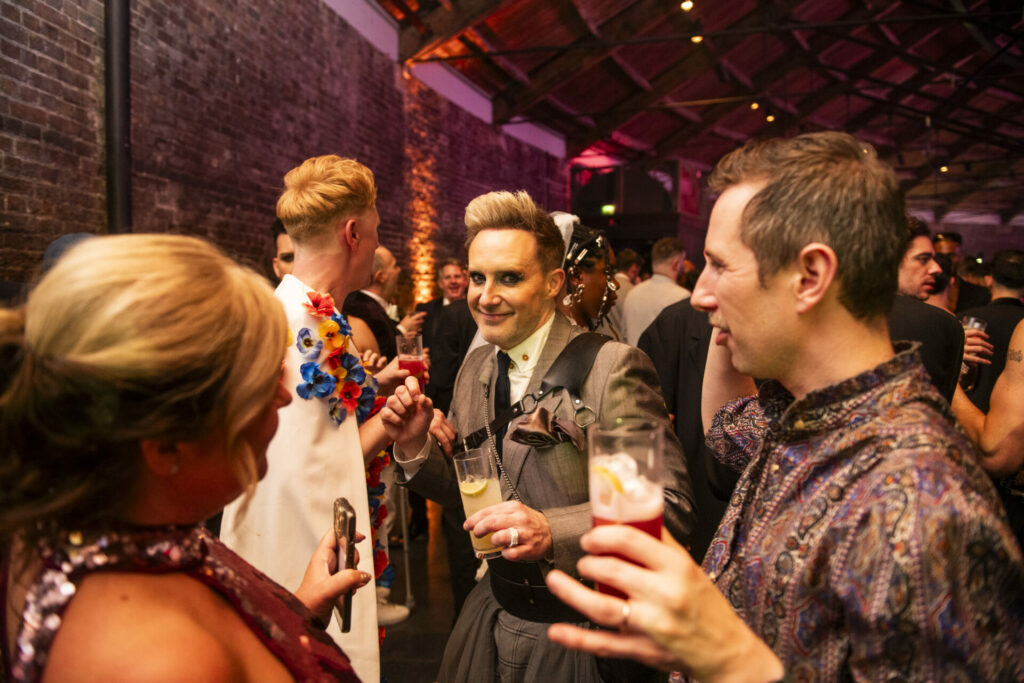 Ian 'H' Watkins posing with a drink