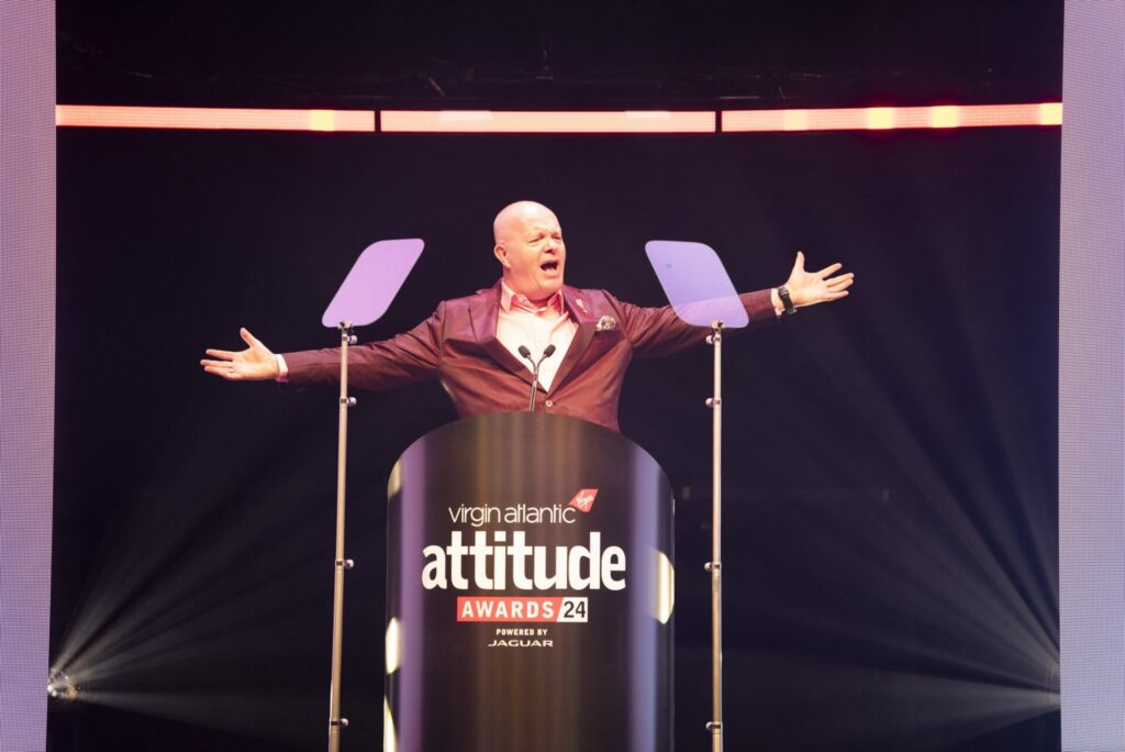 Darren Styles in a suit on stage