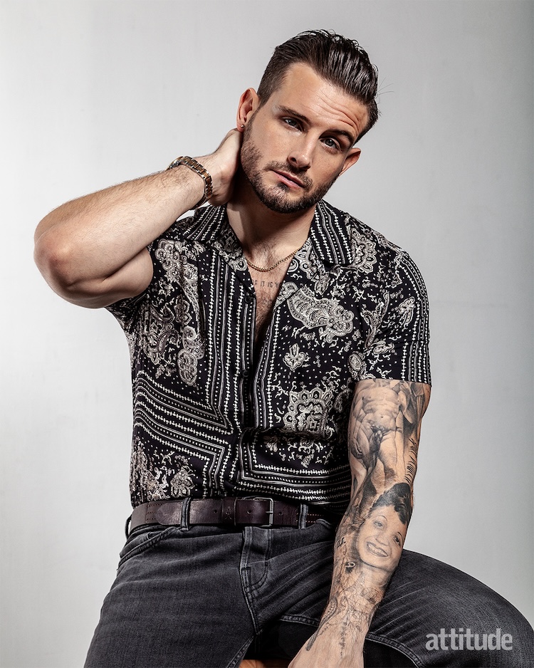 nico in a black patterned shirt with hair in a quiff, in a shot from his attitude shoot