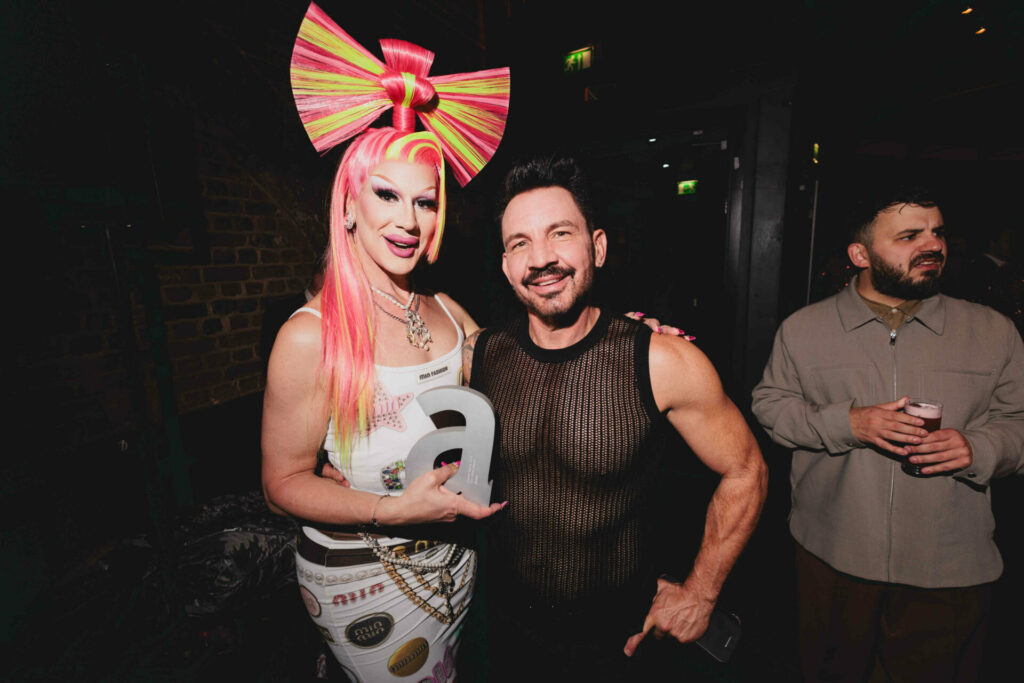 The drag queen Jimbo and her partner Brady Taylor post together for a photo