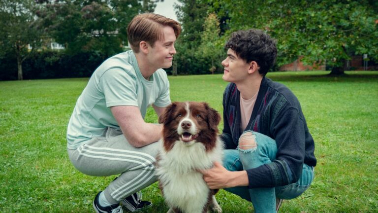 The actors Kit Connor, Joe Locke and a dog in a still from the TV show Heartstopper