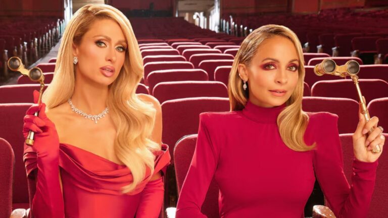 Paris Hilton and Nicole Richie wearing red dresses sat in a theatre