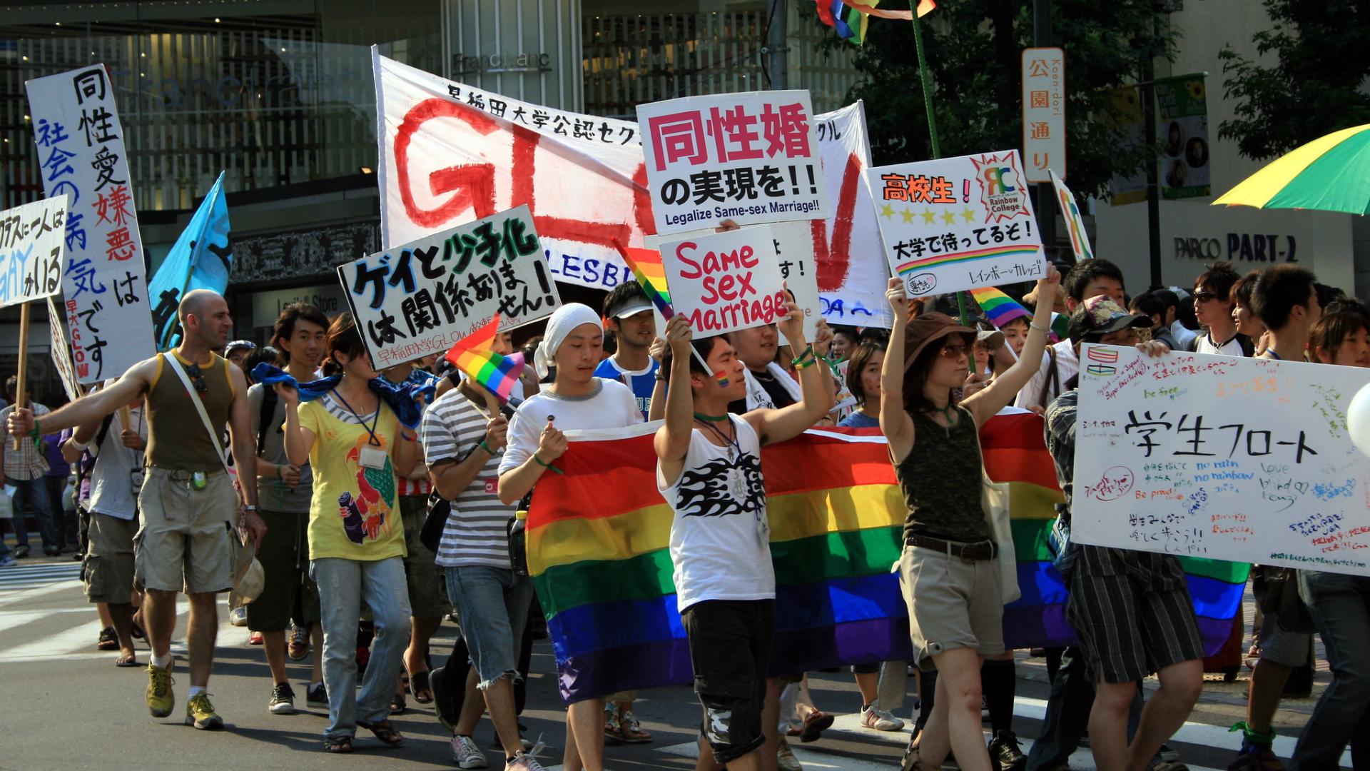 Pride march in Tokyo, Japan, with protesters carrying signs for equal marriage