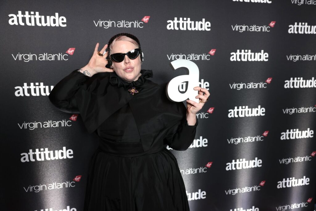 The Blessed Madonna wearing sunglasses holding her Attitude Award