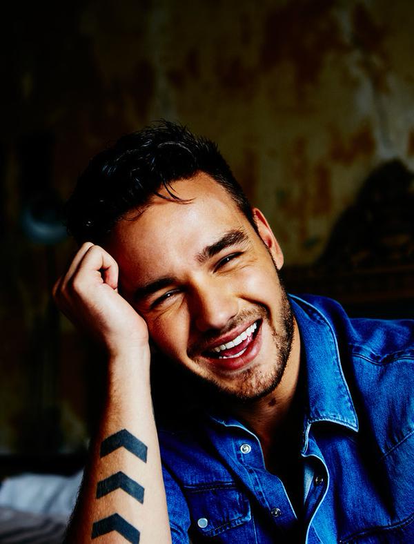 Liam in a blue shirt smiling