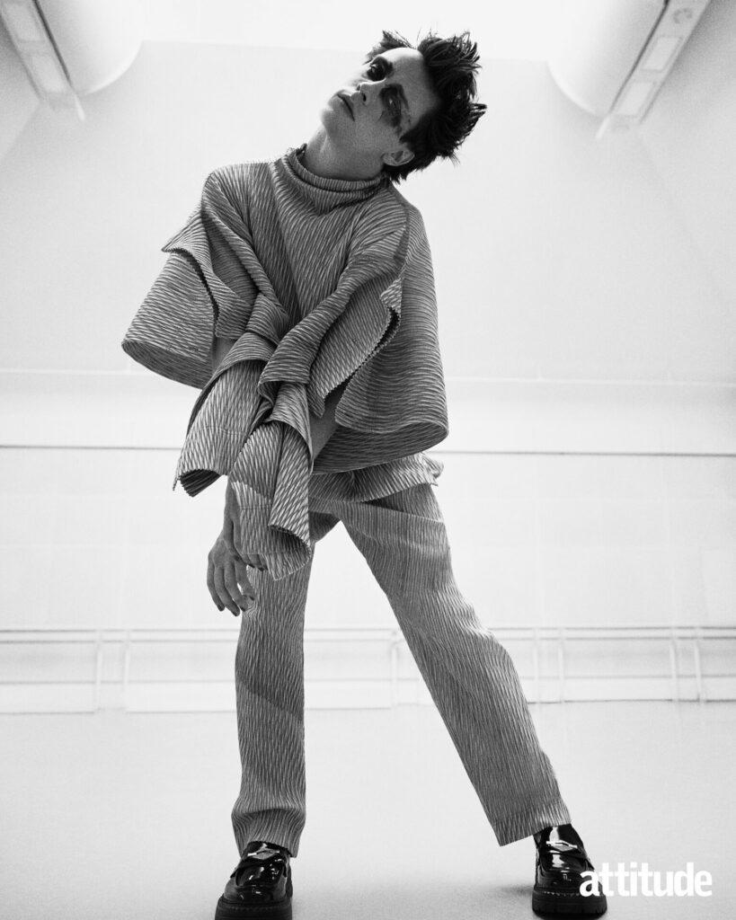 Calvin poses in voluminous top and trousers by Homme Plissé Issey Miyake