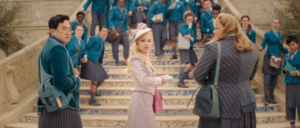 Bowen Yang, Ariana and Bronwyn James in character in Wicked standing on some steps