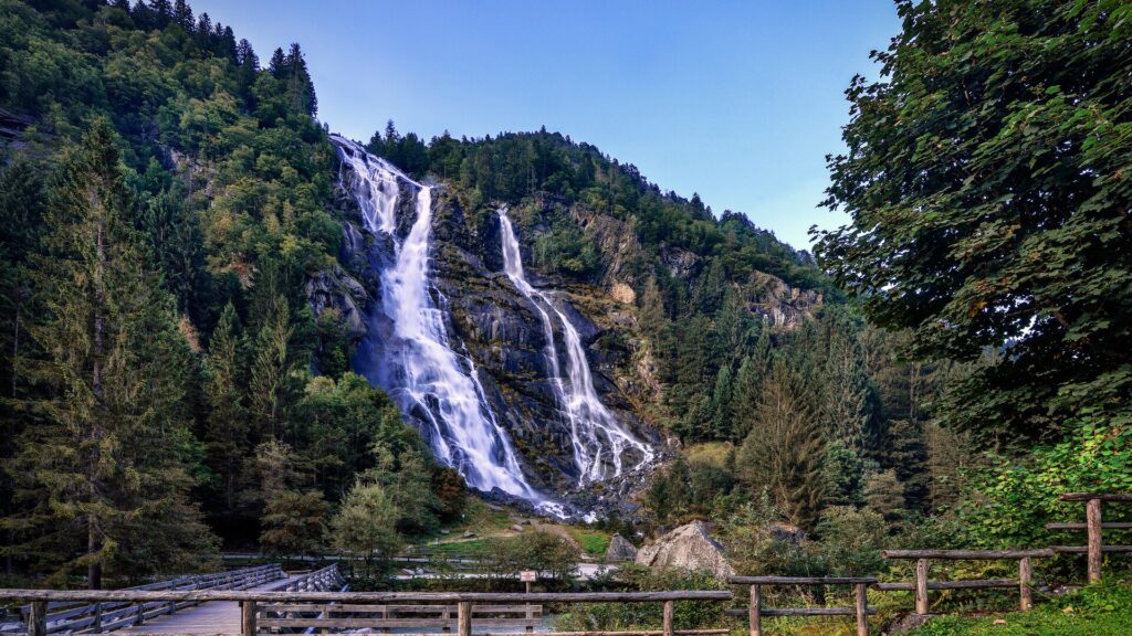 Dolomites mountains and waterfall scenery