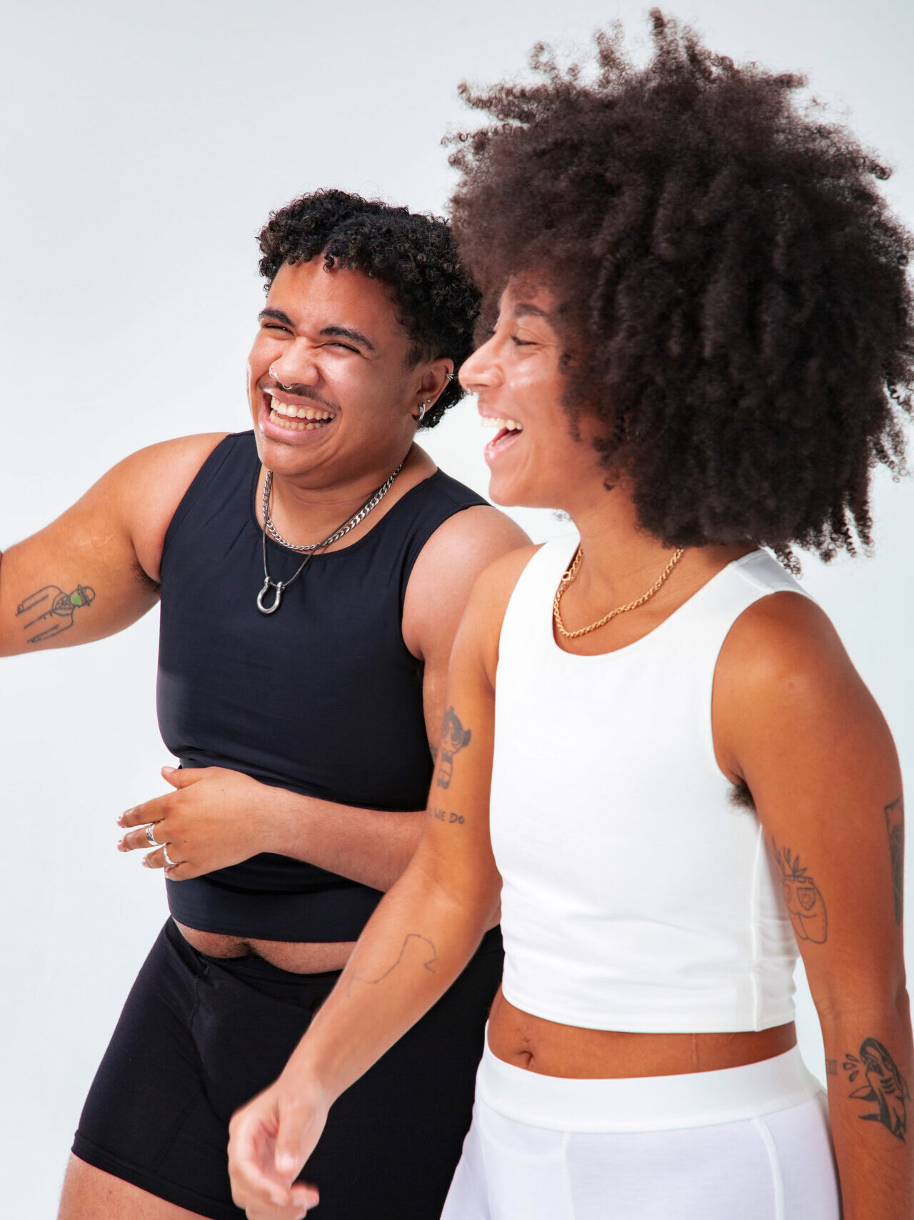 two models in vests and underwear