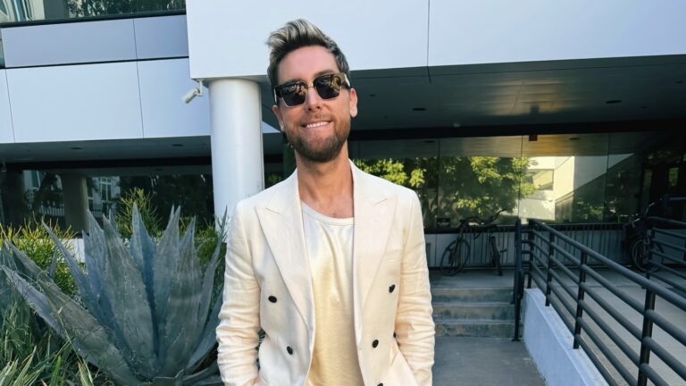 Lance Bass in a cream blazer and t-shirt.