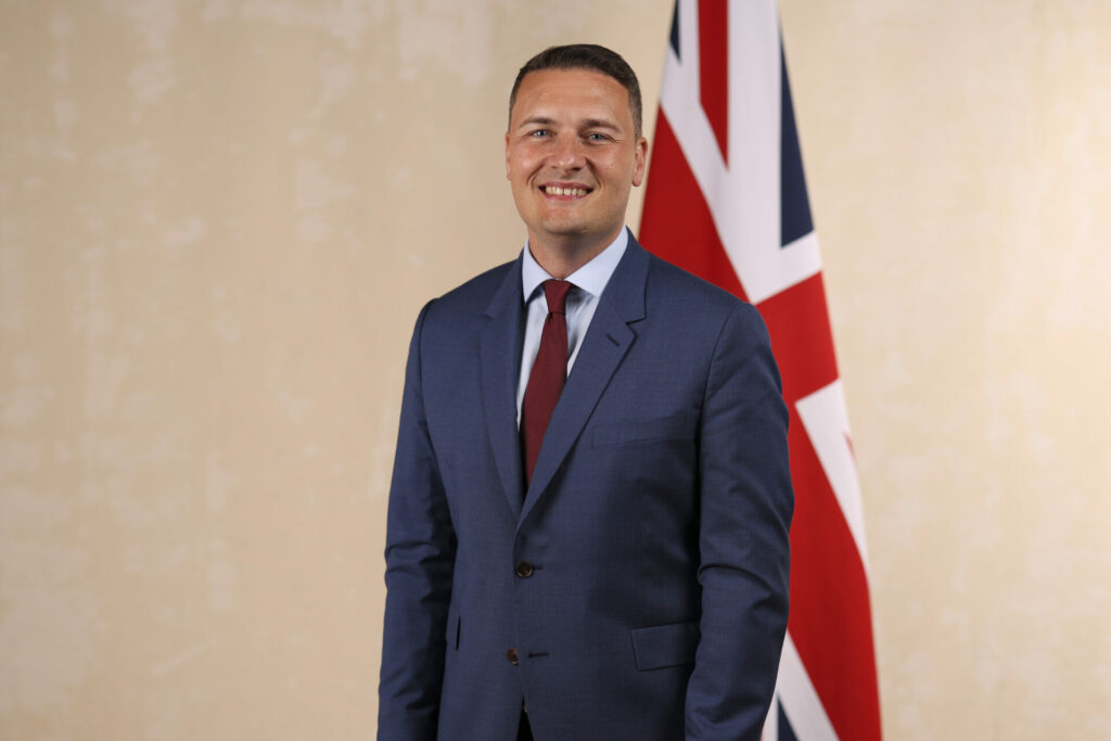 Wes Streeting wearing a blue suit 