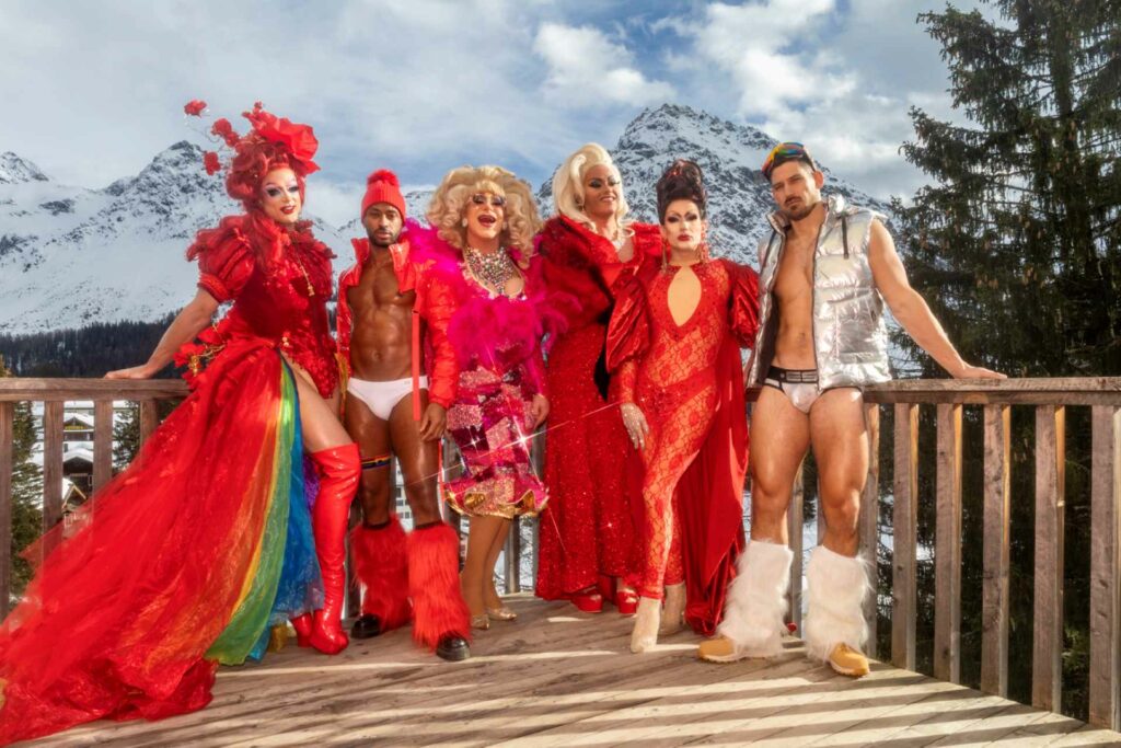 Drag queens standing in a ski resort