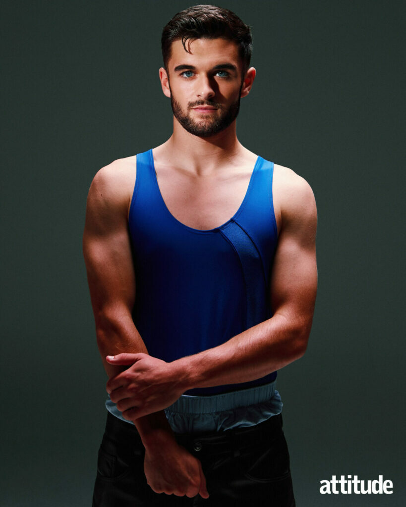 Jake Daniels in a blue vest