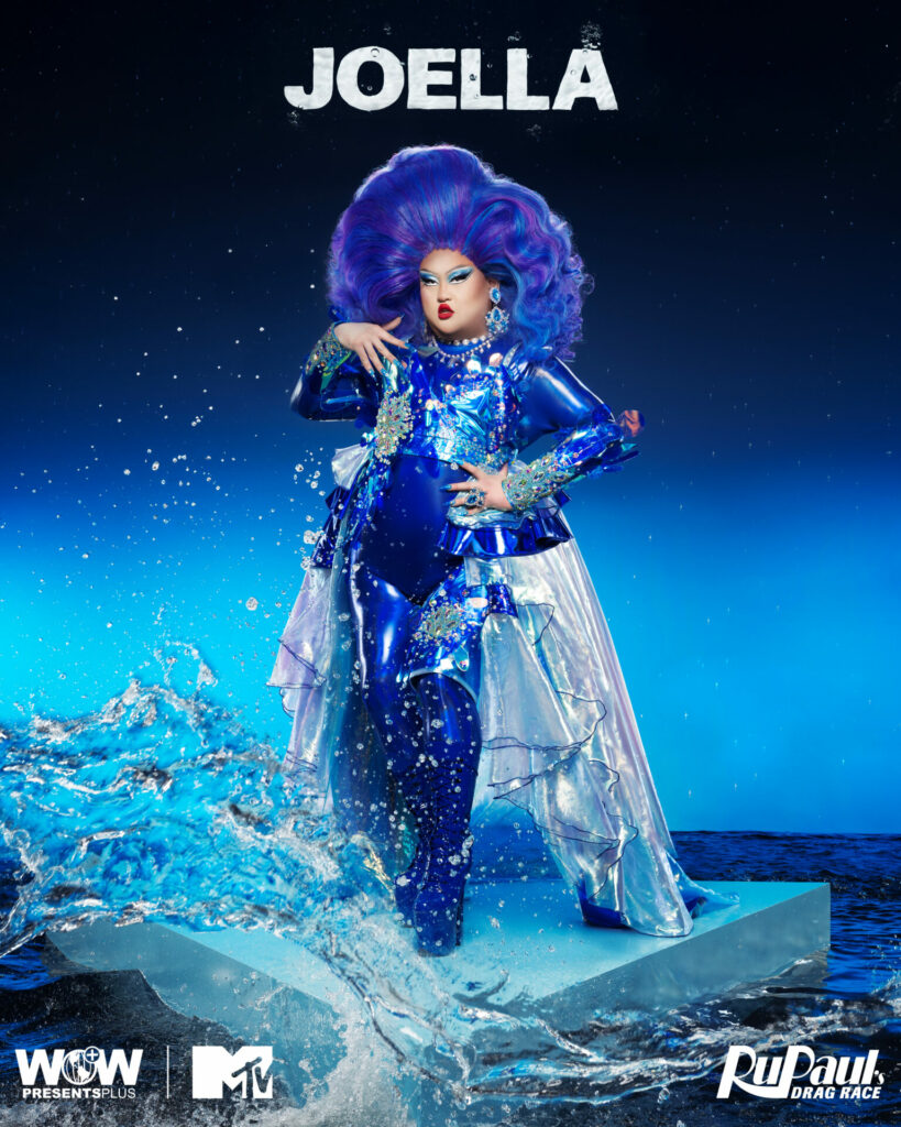 A drag queen against a water-themed blue backdrop