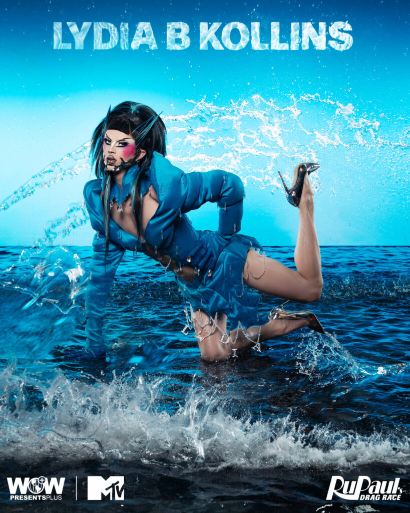 A drag queen against a water-themed blue backdrop