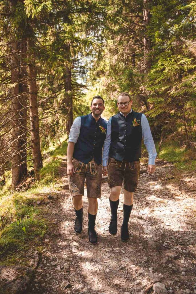 Two men walking in a forest