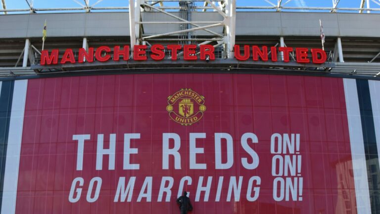 A stadium with a Manchester United sign on it.