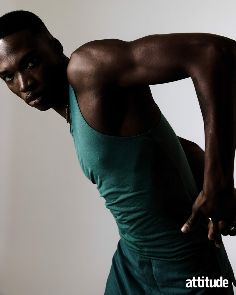 Model poses in green tank and matching cargo trousers